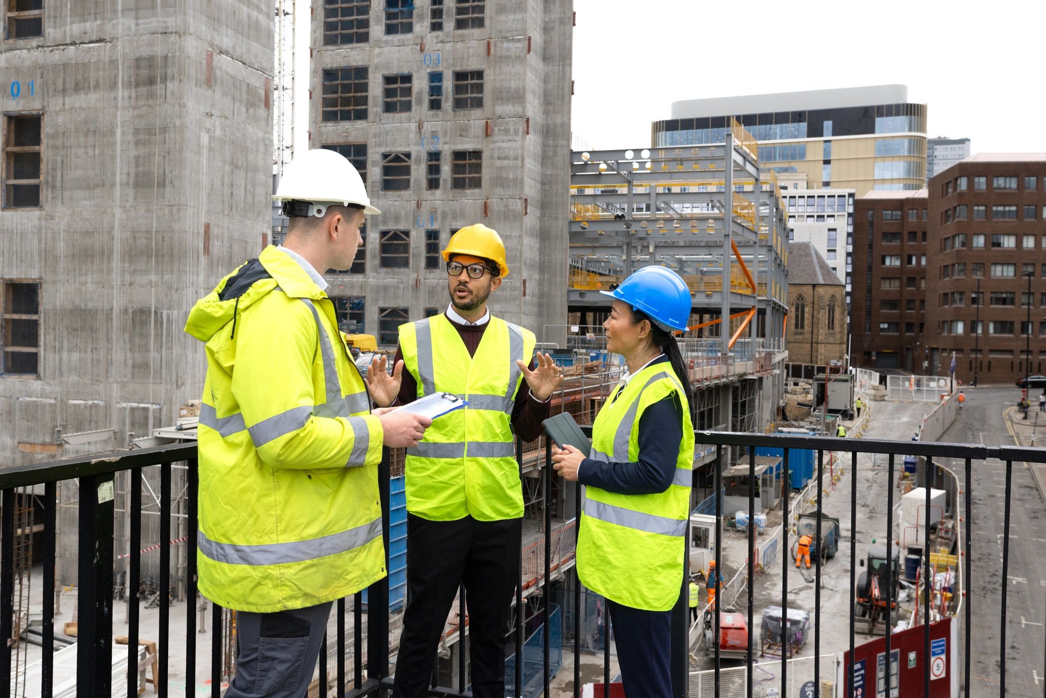 Construction team discussing plans at a project site
